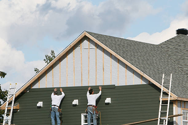 Professional Vinyl Siding technician working in Louisville, OH
